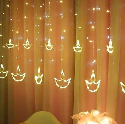 Warm White Diya/Diwali Light Curtain LED String Lights with 12 Hanging Diyas, 8 Flashing Modes, and Prong Base for Decoration